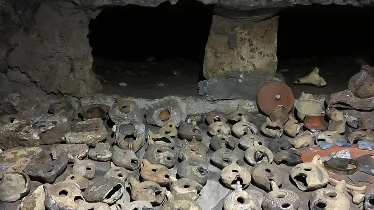 Catacombs with a tour guide by Transport